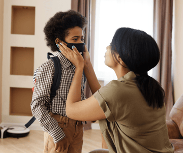 mother-sending-child-to-school-with-facemask-on-new-protocols-for-back-to-school