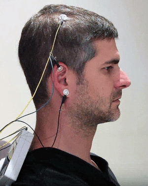 neuroptimal eeg sensors placed on scalp and ear during a neurofeedback training session