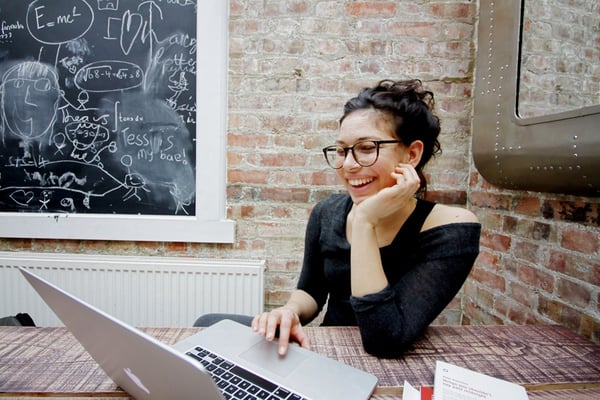 ellyot-588064-unsplash-woman-at-workplace