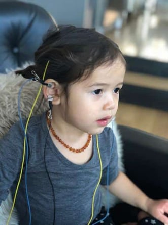 child doing home neurofeedback training