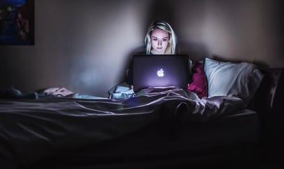 woman with a computer in bed